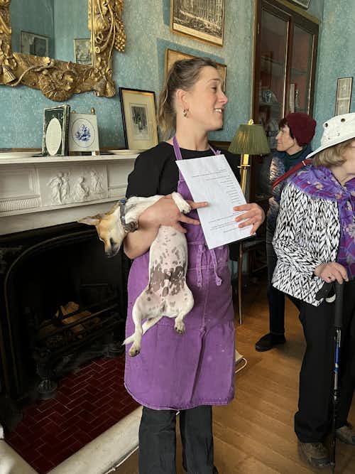 Julie Shelswell-White taking Huron around Bantry House (White family home from 1730s) with Dougal (sleeping canine) at her side.