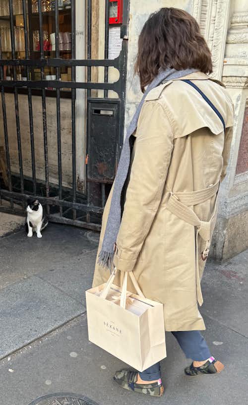 Huron's Katie Kosta asking a local Parisian for their favorite seafood restaurant recommendations